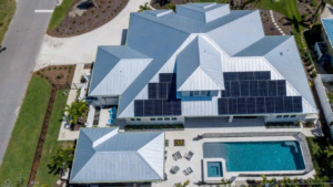 Aerial view of a modern home with a Mirasol Solar panel installation, highlighting sustainable energy solutions for residential properties.