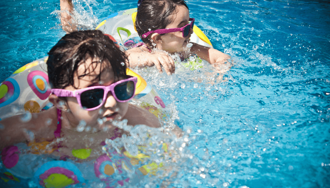 Mirasol Solar pool heating—smiling child swimming underwater in solar-heated pool for family fun