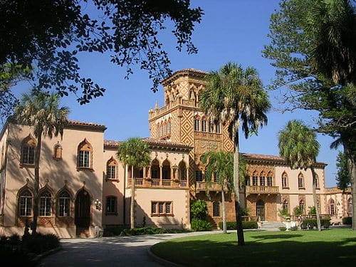 Charlotte County Courthouse in Punta Gorda, Florida, featuring historic architecture with columns and an American flag in front Charlotte County Courthouse in Punta Gorda, Florida, featuring historic architecture with columns and an American flag in front