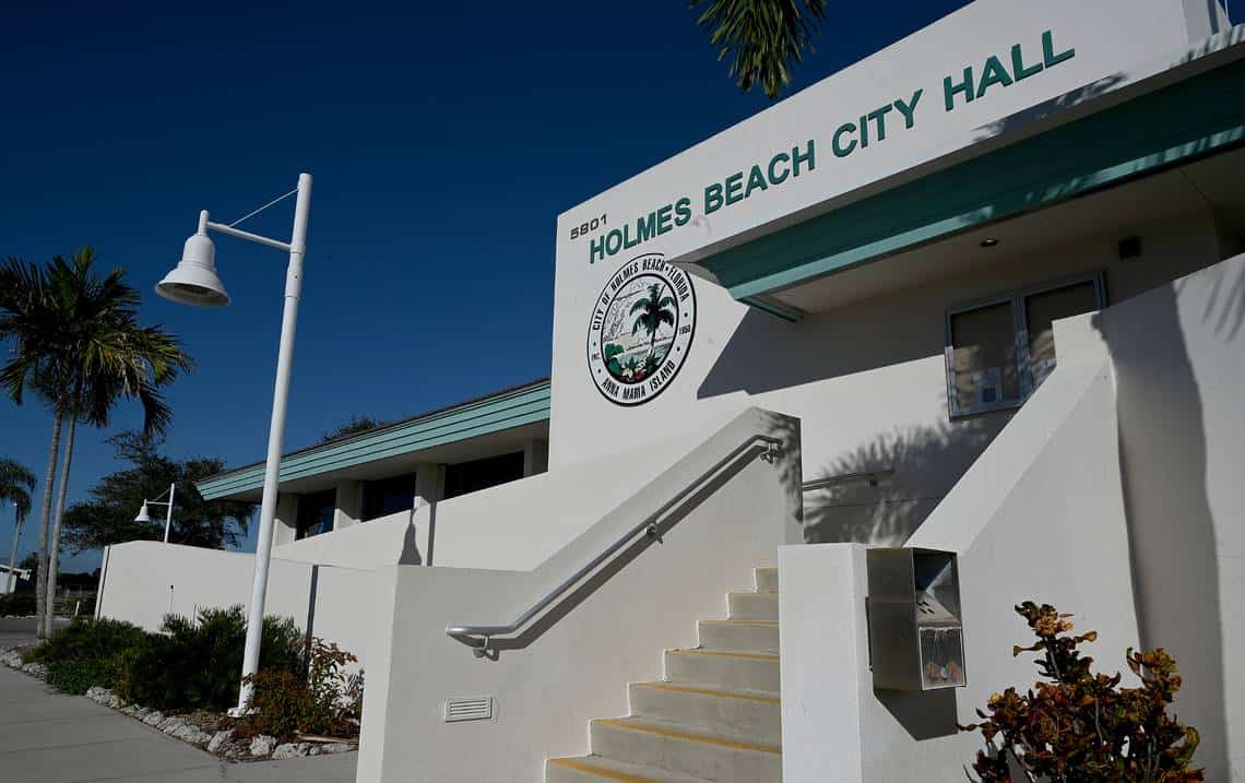 Charlotte County Courthouse in Punta Gorda, Florida, featuring historic architecture with columns and an American flag in front Charlotte County Courthouse in Punta Gorda, Florida, featuring historic architecture with columns and an American flag in front