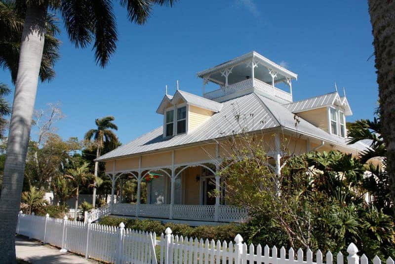 Charlotte County Courthouse in Punta Gorda, Florida, featuring historic architecture with columns and an American flag in front Charlotte County Courthouse in Punta Gorda, Florida, featuring historic architecture with columns and an American flag in front