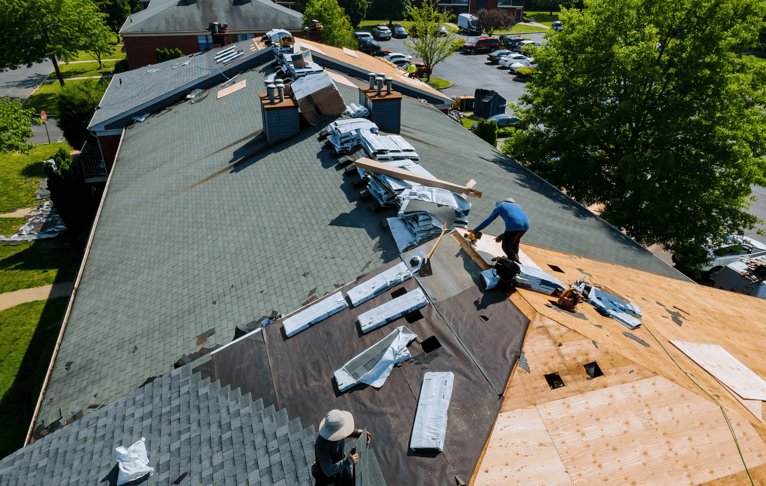 Aerial view of Mirasol Solar Roofing crew completing full roof replacement - decking, underlayment, and new shingles installation