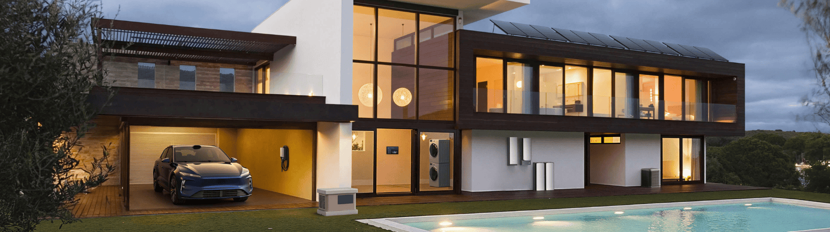  A modern two-story home at dusk with solar panels on the roof, a blue electric vehicle parked in the garage, an EV charger on the garage wall, a portable generator on the lawn, and a wall-mounted battery storage unit on the exterior — with a illuminated pool in the foreground.